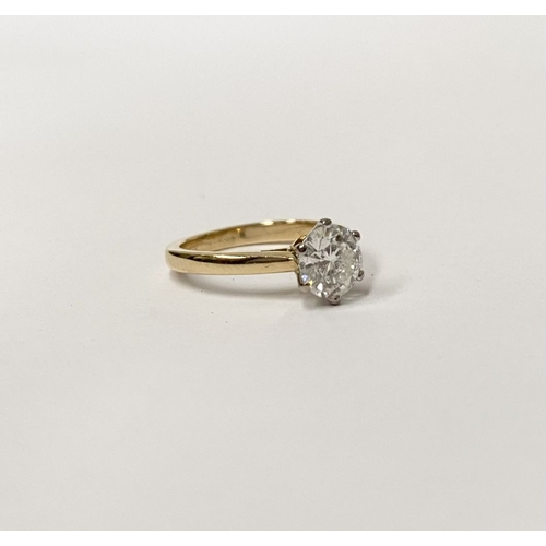 5 - A BEAUTIFUL 18CT YELLOW GOLD DIAMOND SOLITAIRE RING, with central round brilliant cut diamond set in... 