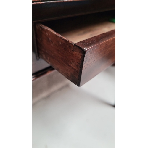 56 - A GEORGIAN MAHOGANY FOLD OVER TEA TABLE, with a single narrow drawer to the front frieze with brass ... 