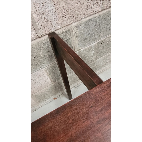 56 - A GEORGIAN MAHOGANY FOLD OVER TEA TABLE, with a single narrow drawer to the front frieze with brass ... 