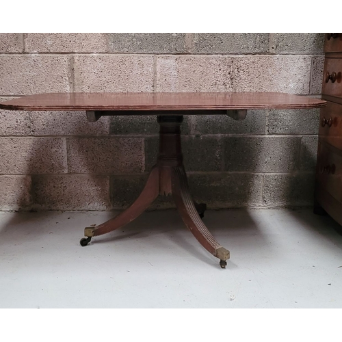 57 - A GOOD QUALITY REGENCY MAHOGANY TIP-UP TABLE, the rectangular table has a reeded edge and rests upon... 