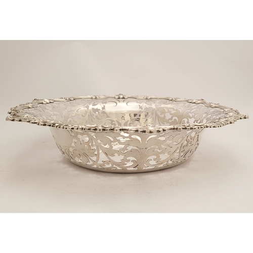 63 - A VERY FINE PAIR OF EARLY 20TH CENTURY SILVER FRUIT DISHES, each with beautiful chased foliage scrol... 