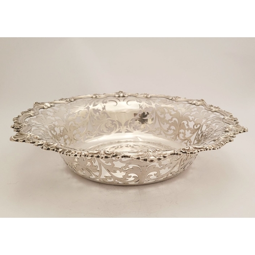 63 - A VERY FINE PAIR OF EARLY 20TH CENTURY SILVER FRUIT DISHES, each with beautiful chased foliage scrol... 