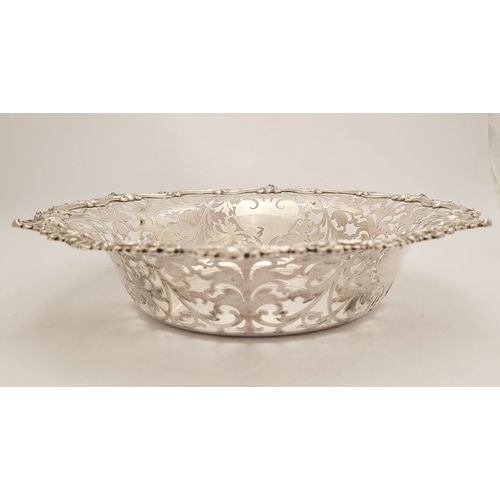 63 - A VERY FINE PAIR OF EARLY 20TH CENTURY SILVER FRUIT DISHES, each with beautiful chased foliage scrol... 