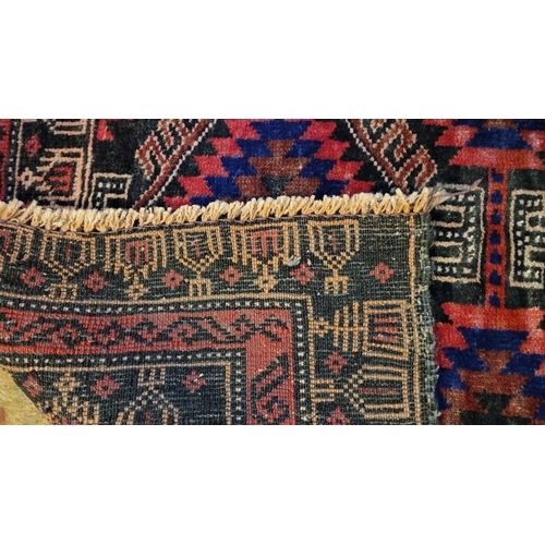 70 - A VERY GOOD QUALITY WOOVEN NEAT SIZED BALUCH FLOOR RUG, with triple diamond shaped medallions to the... 