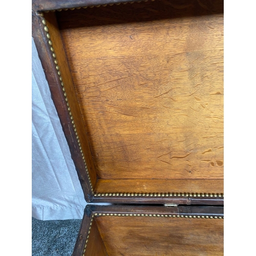 78 - A GOOD OAK LINED LEATHER TRUNK CHEST, the exterior with steel stud decoration and steel handles to s... 