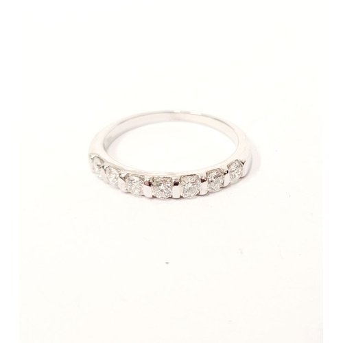 79 - AN 18CT WHITE GOLD 7 STONE HALF ETERNITY DIAMOND RING, the diamonds are a nice bright, ring size: N ... 