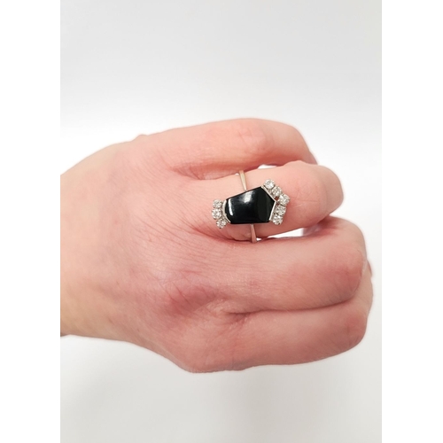 83 - A RARE 18CT GOLD ONYX & DIAMOND RING, set with beautiful sparkling brilliant cut diamonds; approxima... 