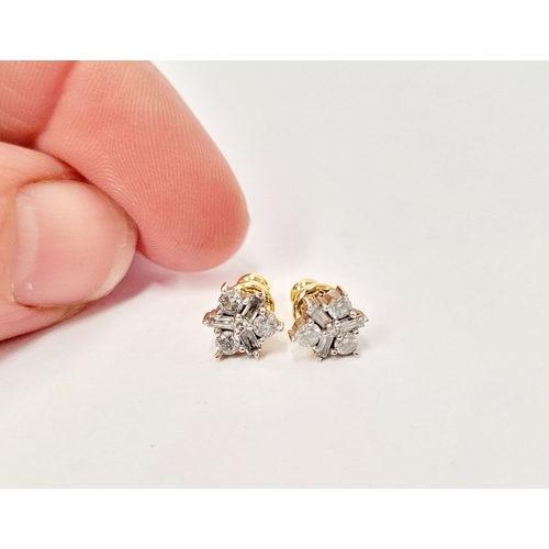 87 - A PAIR OF 9CT YELLOW GOLD BACKED SPARKLING FLORAL DESIGN DIAMOND CLUSTER STUD EARRINGS, with a mix o... 