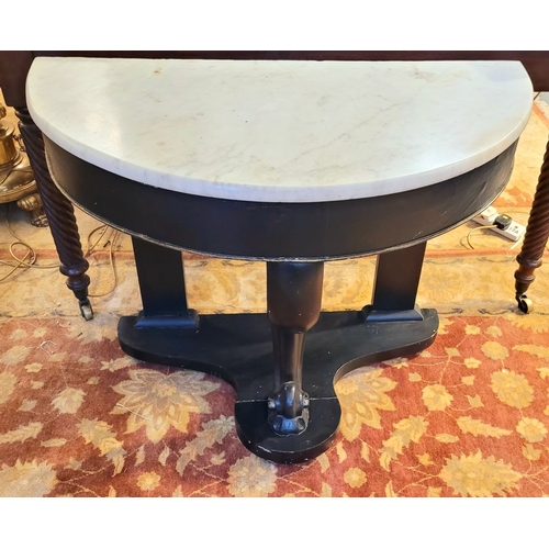 88 - A DEMI LUNE SHAPED MARBLE TOPPED CONSOLE TABLE / HALL TABLE, with carved scroll shaped upright suppo... 