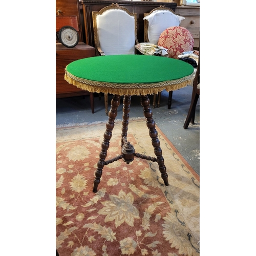 90 - A GOOD QUALITY CIRCULAR ‘GYPSY’ OAK BASED TABLE, with circular green baize covered top finished with... 