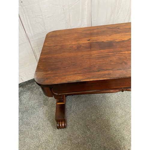 297 - A WILLIAM IV ROSEWOOD LIBRARY TABLE, with two drawers to frieze atop carved lyre supports on pod bas... 