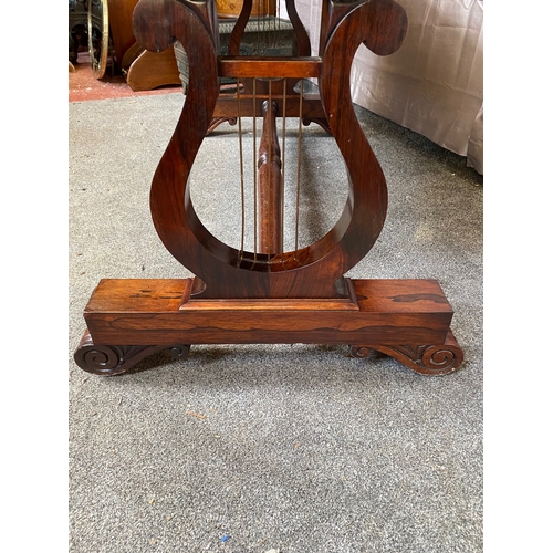 297 - A WILLIAM IV ROSEWOOD LIBRARY TABLE, with two drawers to frieze atop carved lyre supports on pod bas... 