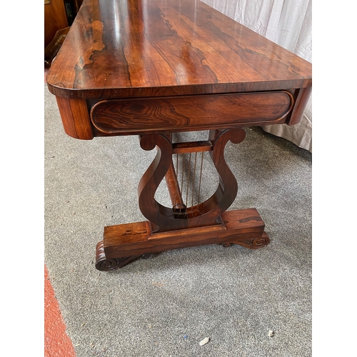 297 - A WILLIAM IV ROSEWOOD LIBRARY TABLE, with two drawers to frieze atop carved lyre supports on pod bas... 