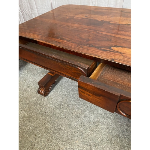 297 - A WILLIAM IV ROSEWOOD LIBRARY TABLE, with two drawers to frieze atop carved lyre supports on pod bas... 