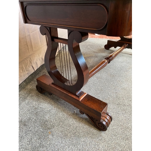 297 - A WILLIAM IV ROSEWOOD LIBRARY TABLE, with two drawers to frieze atop carved lyre supports on pod bas... 