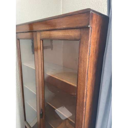 311 - AN IRISH MID-CENTURY BALFE’S OF DUBLIN OAK TWO DOOR GLAZED BOOKCASE, in very good condition, with ad... 