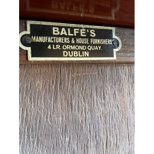 311 - AN IRISH MID-CENTURY BALFE’S OF DUBLIN OAK TWO DOOR GLAZED BOOKCASE, in very good condition, with ad... 