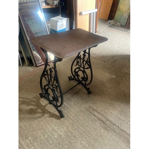 319 - A CAST IRON BASED TABLE, lovely scrolling detail to the base supports – united by a bar stretcher. T... 