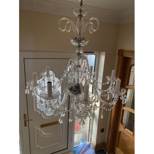 21 - A BEAUTIFUL CRYSTAL EIGHT BRANCH CHANDELIER, with cut glass support, eight scrolling branches with c... 