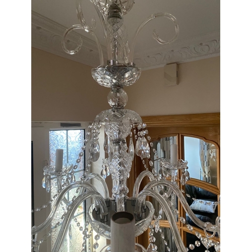 21 - A BEAUTIFUL CRYSTAL EIGHT BRANCH CHANDELIER, with cut glass support, eight scrolling branches with c... 