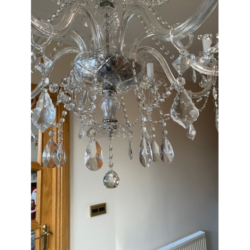 21 - A BEAUTIFUL CRYSTAL EIGHT BRANCH CHANDELIER, with cut glass support, eight scrolling branches with c... 