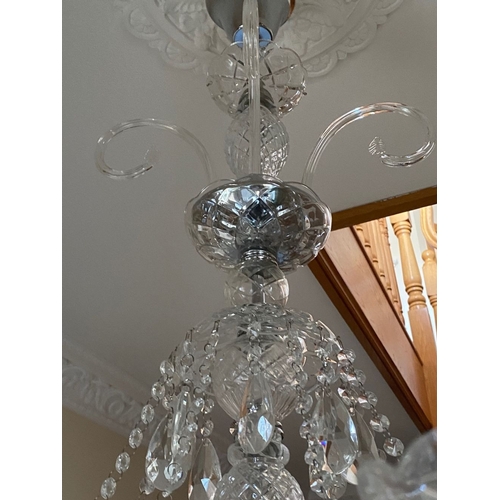 21 - A BEAUTIFUL CRYSTAL EIGHT BRANCH CHANDELIER, with cut glass support, eight scrolling branches with c... 