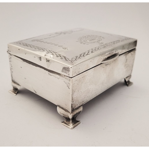 31 - AN EARLY 20TH CENTURY SILVER BOX, with hinged lid, the top decorated with bright cut decoration of r... 