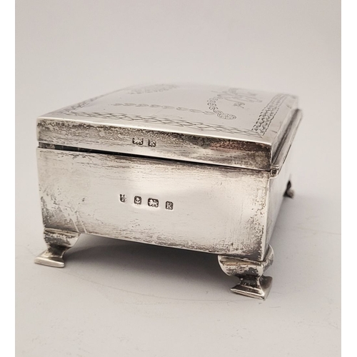 31 - AN EARLY 20TH CENTURY SILVER BOX, with hinged lid, the top decorated with bright cut decoration of r... 