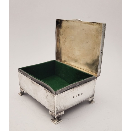 31 - AN EARLY 20TH CENTURY SILVER BOX, with hinged lid, the top decorated with bright cut decoration of r... 