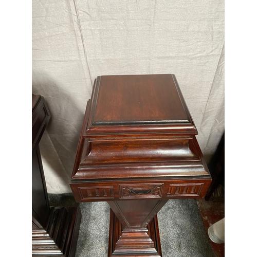 44 - A PAIR OF MAHOGANY ADAMS STYLE PEDESTALS/PLANT STANDS, with decorative carved panel featuring swag d... 