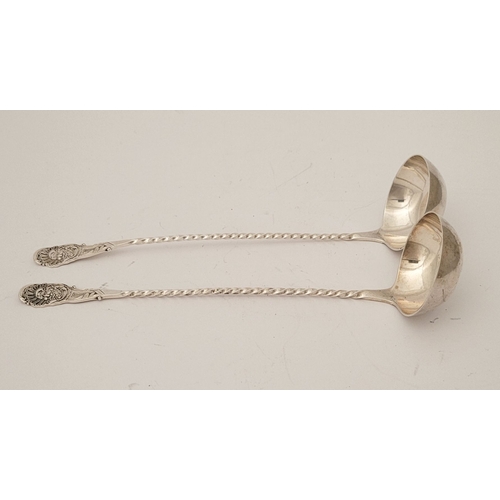 52 - A FINELY CRAFTED PAIR OF LATE 19TH CENTURY SILVER CREAM LADLES, each with a barley-twist tem and tip... 