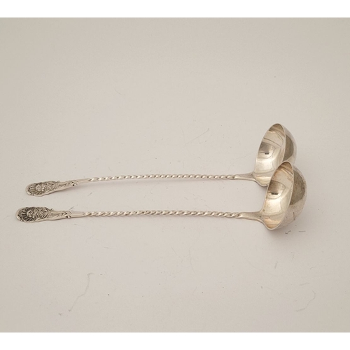 52 - A FINELY CRAFTED PAIR OF LATE 19TH CENTURY SILVER CREAM LADLES, each with a barley-twist tem and tip... 