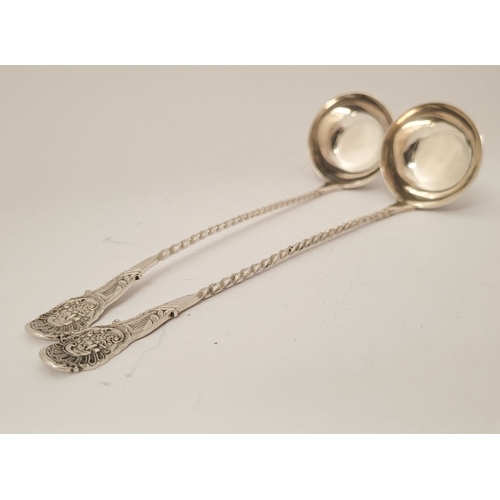 52 - A FINELY CRAFTED PAIR OF LATE 19TH CENTURY SILVER CREAM LADLES, each with a barley-twist tem and tip... 