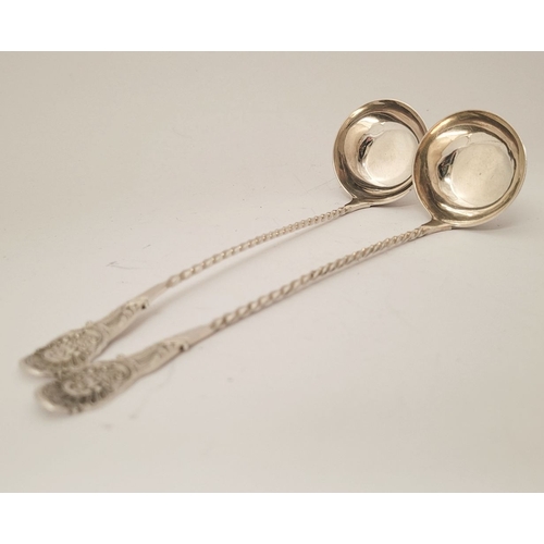 52 - A FINELY CRAFTED PAIR OF LATE 19TH CENTURY SILVER CREAM LADLES, each with a barley-twist tem and tip... 