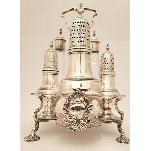 11 - A VERY FINE LATE 18TH CENTURY IRISH SILVER CRUET SET, complete with 2 cut glass bottles, a large sif... 