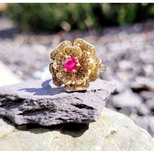 53 - A BESPOKE 14CT YELLOW GOLD PINK SAPPHIRE & DIAMOND FLORAL RING, very pretty design; the central peta... 