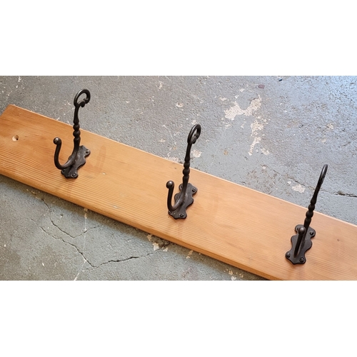 105 - PINE BACKED HEAVY CAST THREE HOOK COAT HANGER PANEL – add detail. 15 x 12 x 84.5cm (H x D x W)