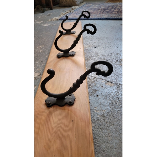 105 - PINE BACKED HEAVY CAST THREE HOOK COAT HANGER PANEL – add detail. 15 x 12 x 84.5cm (H x D x W)