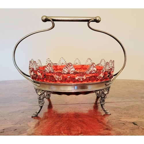 116 - A LATE 19TH CENTURY VICTORIAN BRASS FRAMED RUBY GLASS BOWL, the bowl with rich ruby red colour and c... 