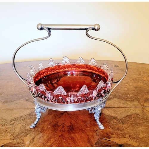 116 - A LATE 19TH CENTURY VICTORIAN BRASS FRAMED RUBY GLASS BOWL, the bowl with rich ruby red colour and c... 