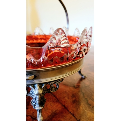 116 - A LATE 19TH CENTURY VICTORIAN BRASS FRAMED RUBY GLASS BOWL, the bowl with rich ruby red colour and c... 