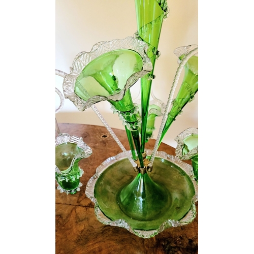 120 - A FANTASTIC VICTORIAN GREEN & CLEAR GLASS EPERGNE, with a central tall flute and three small trumpet... 