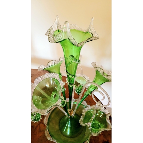 120 - A FANTASTIC VICTORIAN GREEN & CLEAR GLASS EPERGNE, with a central tall flute and three small trumpet... 