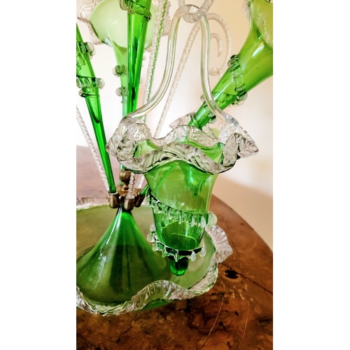 120 - A FANTASTIC VICTORIAN GREEN & CLEAR GLASS EPERGNE, with a central tall flute and three small trumpet... 