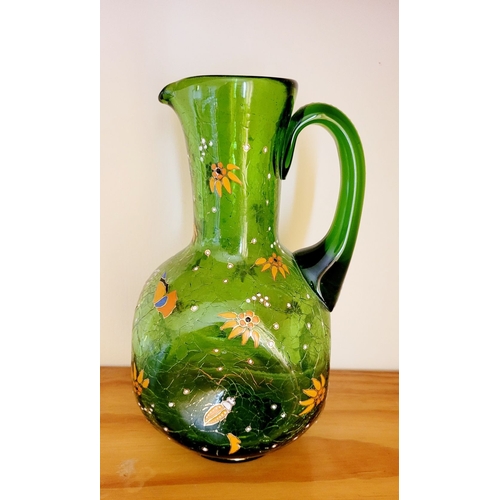 122 - A VINTAGE BOHEMIAN GREEN CRACKLE GLASS ENAMEL PAINTED JUG, with white enamel bead detail the handle,... 