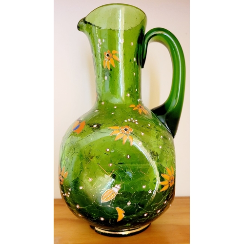 122 - A VINTAGE BOHEMIAN GREEN CRACKLE GLASS ENAMEL PAINTED JUG, with white enamel bead detail the handle,... 