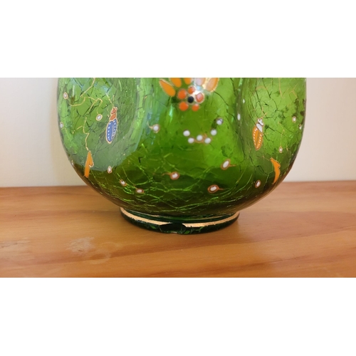 122 - A VINTAGE BOHEMIAN GREEN CRACKLE GLASS ENAMEL PAINTED JUG, with white enamel bead detail the handle,... 