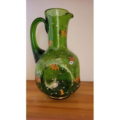 122 - A VINTAGE BOHEMIAN GREEN CRACKLE GLASS ENAMEL PAINTED JUG, with white enamel bead detail the handle,... 