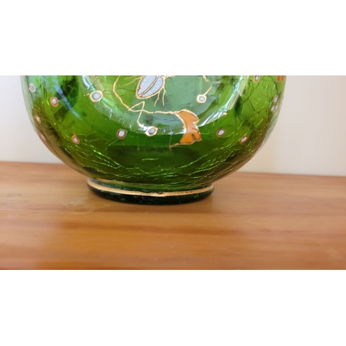 122 - A VINTAGE BOHEMIAN GREEN CRACKLE GLASS ENAMEL PAINTED JUG, with white enamel bead detail the handle,... 