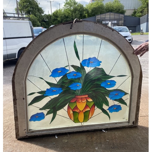 130 - A BEAUTIFUL ARCHED STAINED GLASS WINDOW, c.1993, with blue flowers in vase in vibrant colours, signe... 